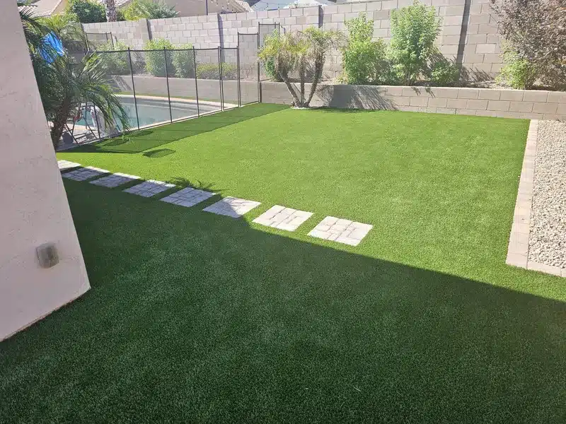 artificial grass and paving stones installation